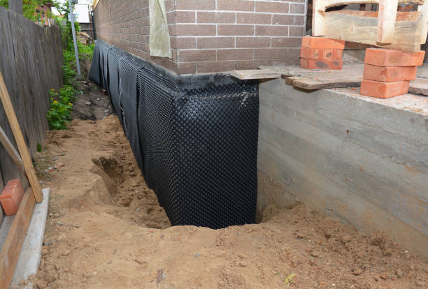 Happy homeowners after waterproofing job in Fallston